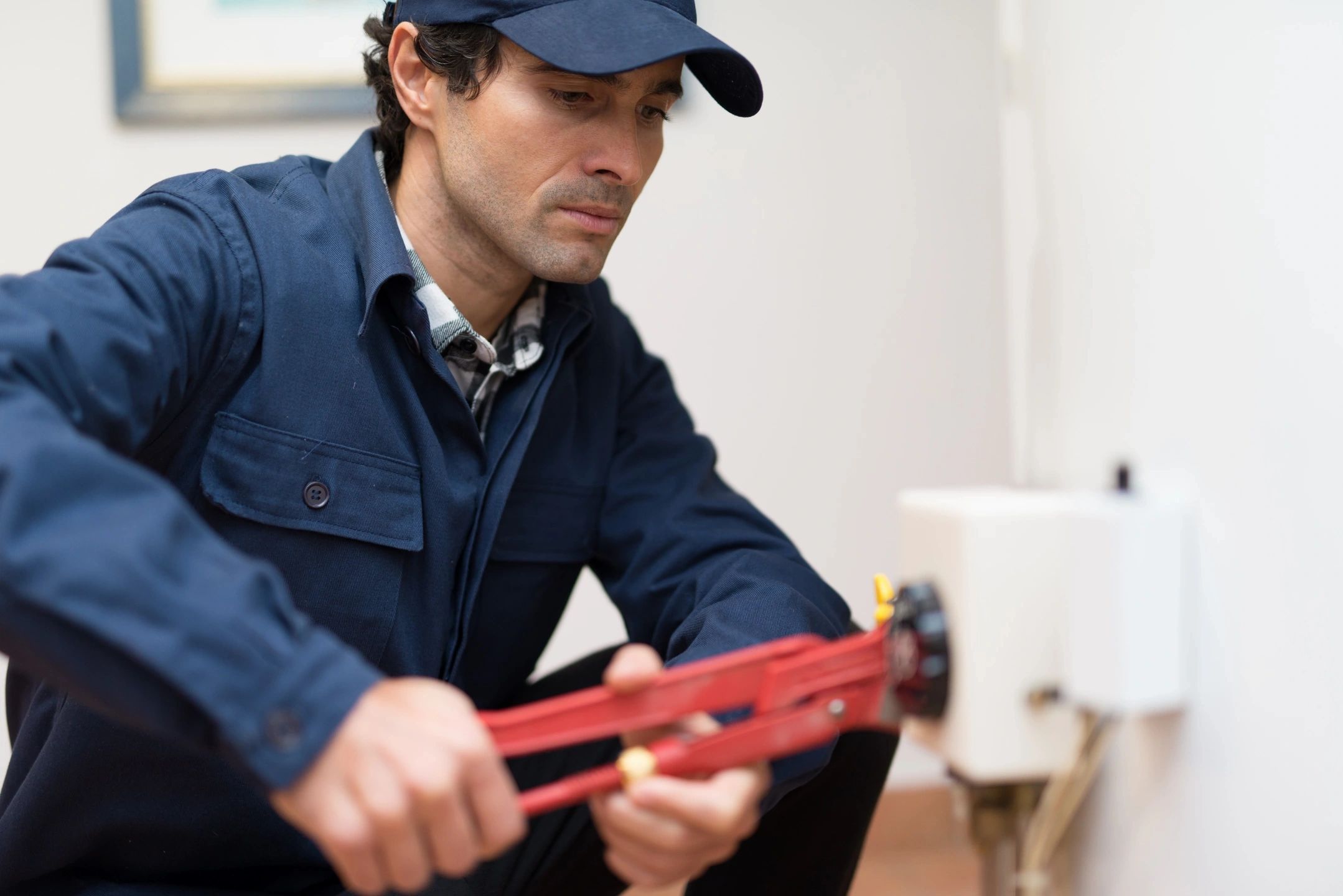 Plumber using pipe wrench